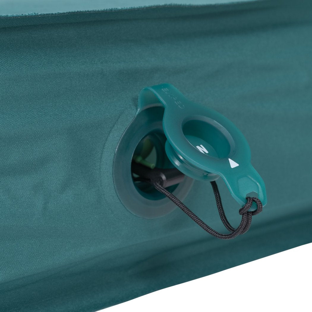 A close-up of the Exped MegaMat Duo showing the valve and attached cord on a teal-colored pad.