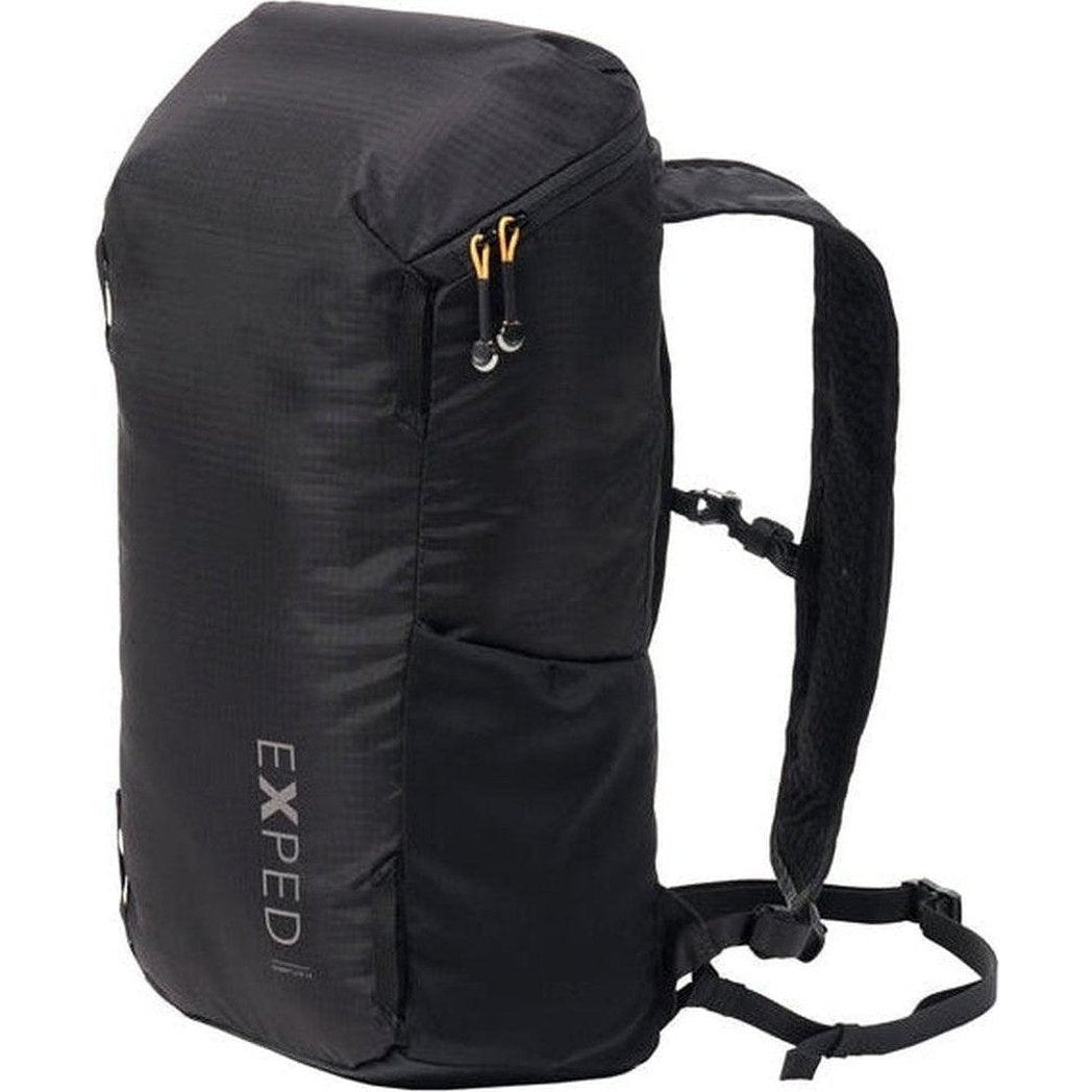 A side view of the black Exped Summit Lite 15 backpack showing its shoulder straps and front pocket against a white background.