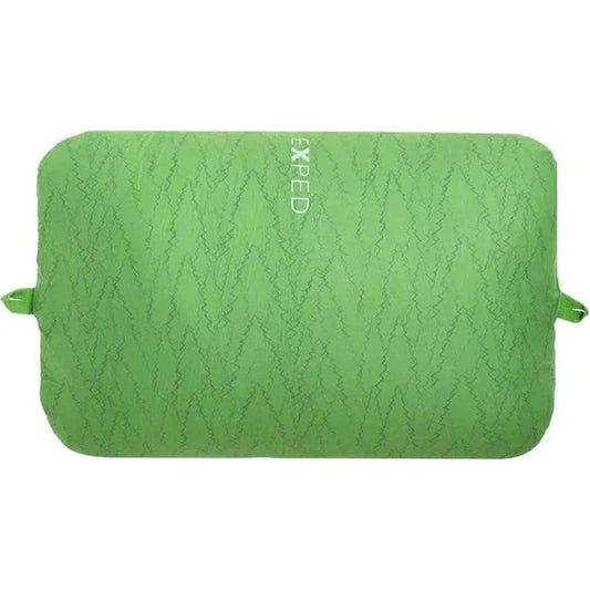 A green Exped Trailhead Pillow with a zigzag pattern and straps on the sides against a white background.