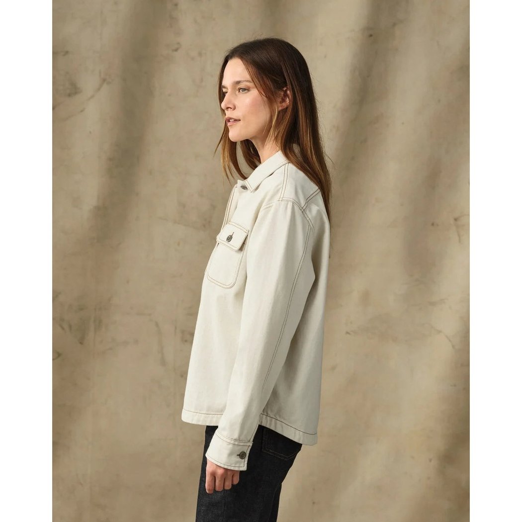 Side view of the Filson Womens Denim Shirt in Natural Seed showing the chest pocket and model wearing it against a neutral background.