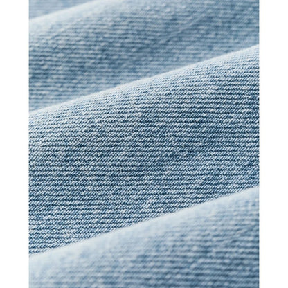 Close-up of the Filson Womens Denim Shirt in Pale Indigo showing the denim weave and soft folds.