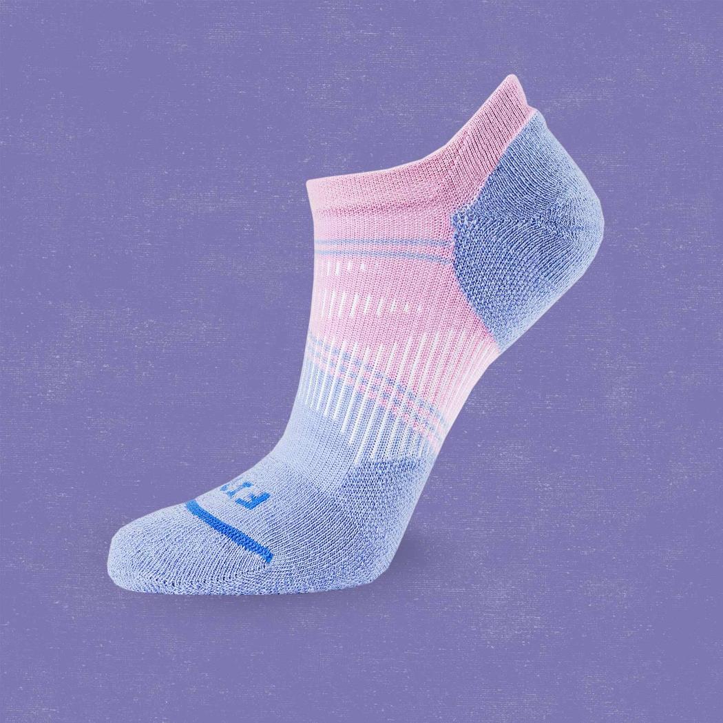 A side view of the FITS Light Cushion Run No Show socks in Lavender Herb against a purple background.
