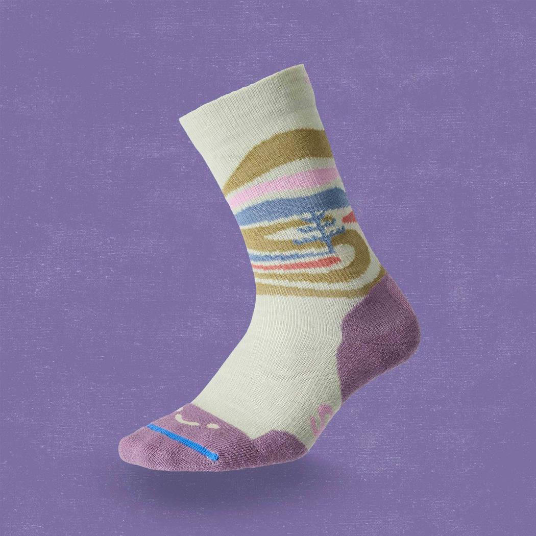 A side view of the FITS Space Desert Original Fit Light Crew sock in Desert Sage against a purple background.