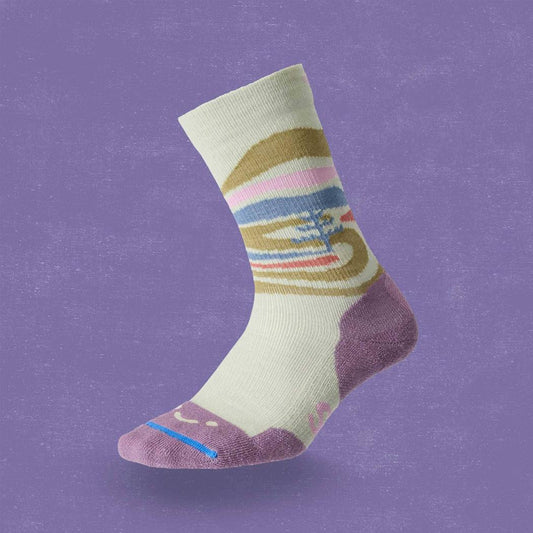 A side view of the FITS Space Desert Original Fit Light Crew sock in Desert Sage against a purple background.