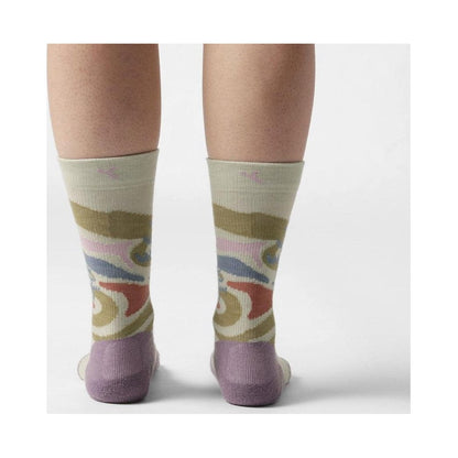 Back view of the FITS Space Desert Original Fit Light Crew socks on a model, showing the colorful pattern and Desert Sage heel and toe against a white background.