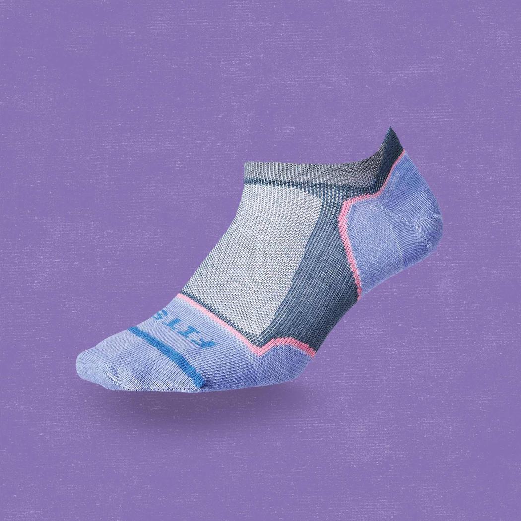 A side view of the FITS Women's Ultra Light Runner No Show sock in Stormy Weather against a purple background.