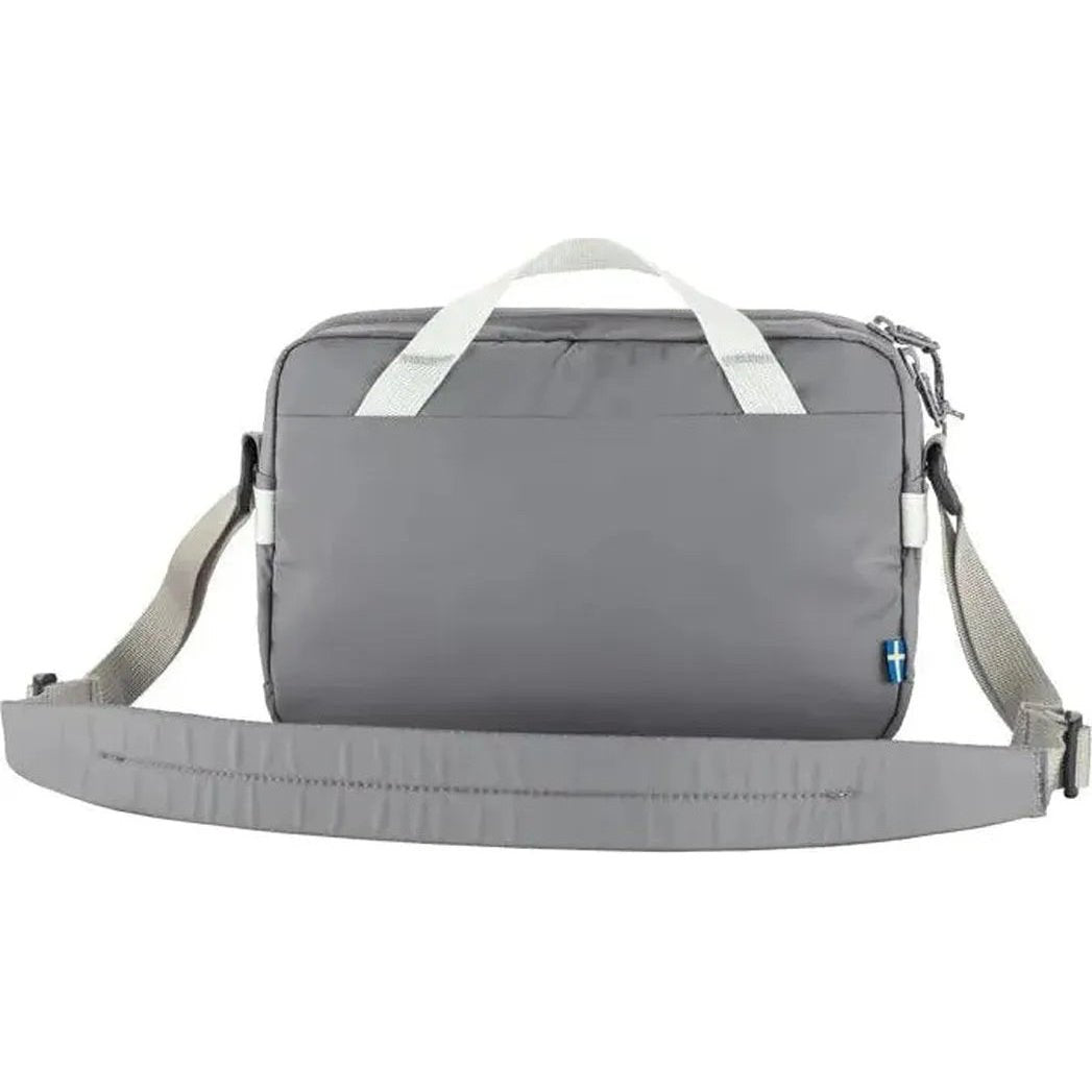 Back view of the Fjallraven High Coast Crossbody in Black showing the shoulder strap and white handles against a white background.