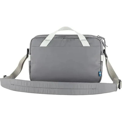 Back view of the Fjallraven High Coast Crossbody in Black showing the shoulder strap and white handles against a white background.
