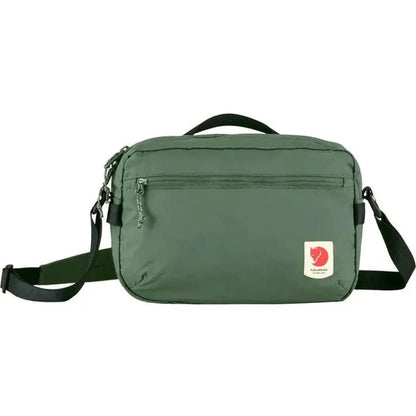 Front view of the Fjallraven High Coast Crossbody in Black with adjustable strap and front zip pocket against a white background.