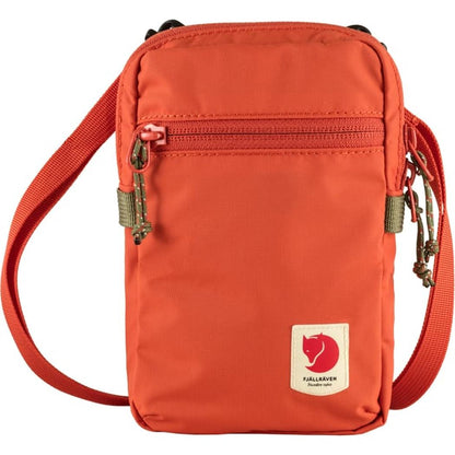 A front view of the Fjallraven High Coast Pocket in Black showing the zippered pocket and adjustable strap against a white background.