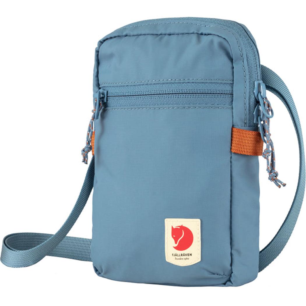 A front view of the Fjallraven High Coast Pocket in Black with a zippered top pocket and adjustable strap.