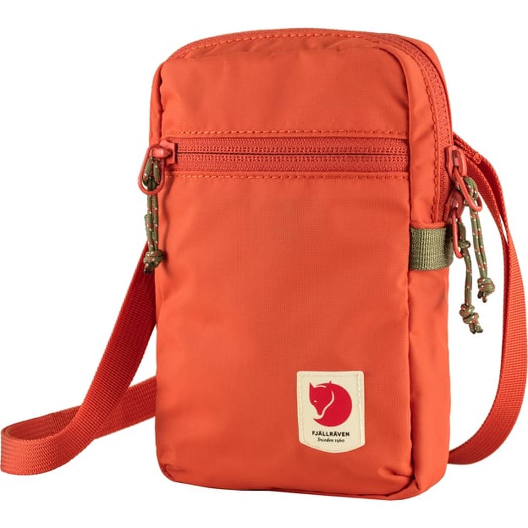 A front view of the Fjallraven High Coast Pocket in Black showing the zippered top pocket and adjustable strap.