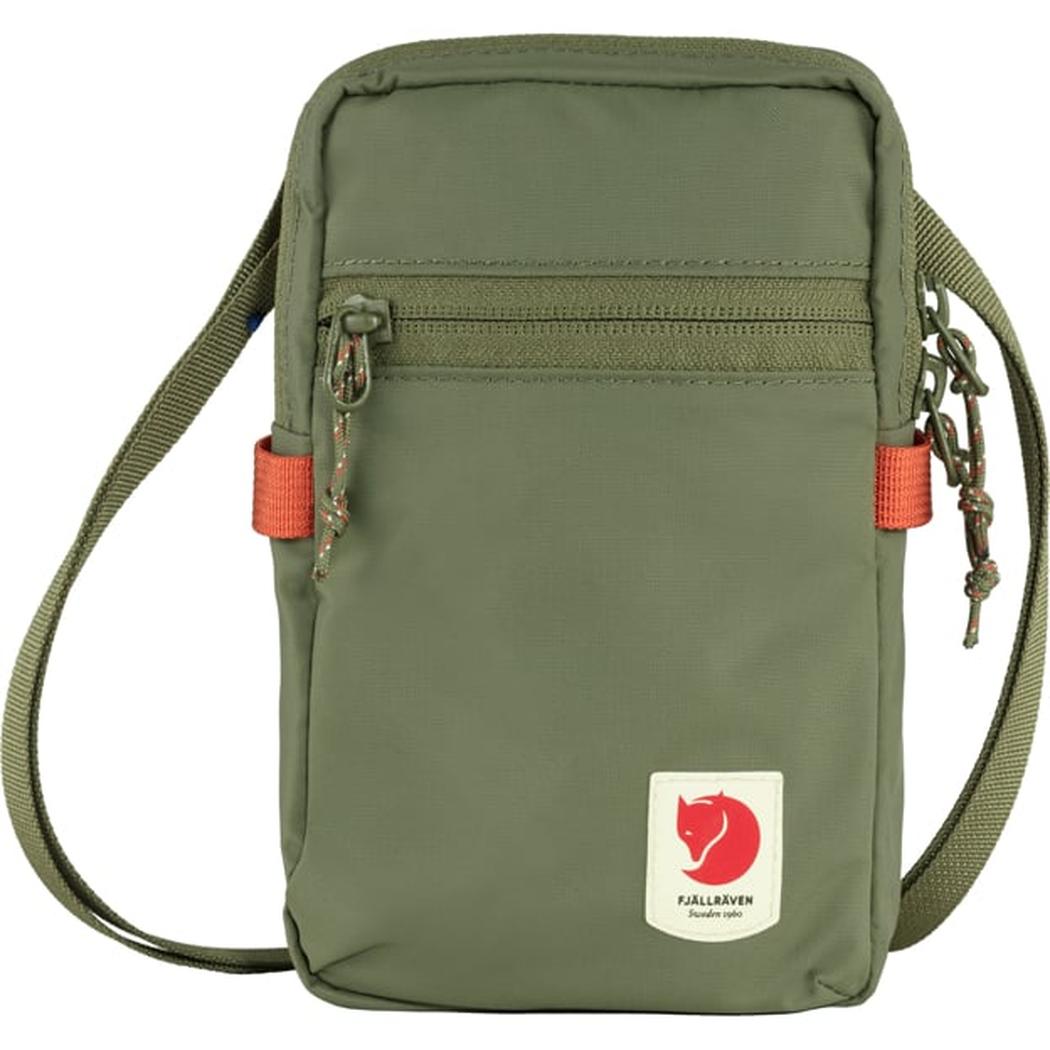 A front view of the Fjallraven High Coast Pocket in Black with a red logo patch and adjustable strap.