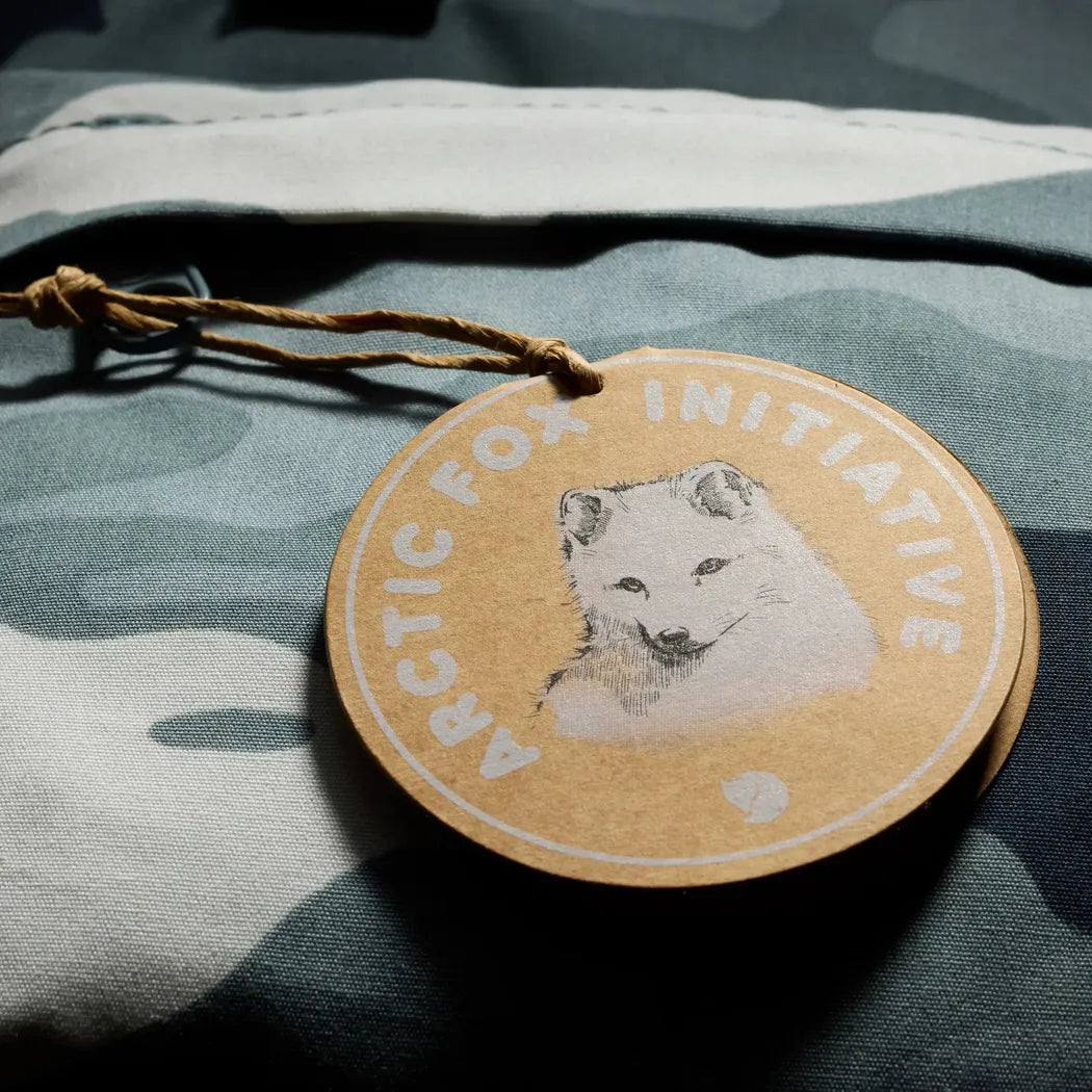 A close-up of the Fjallraven Kanken Graphics Hip Pack in Chalk Rose-Hidden Animals on a camouflage background.