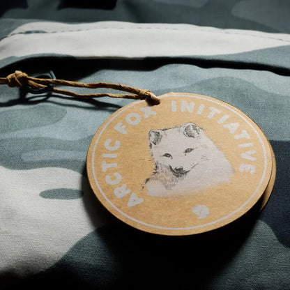 A close-up of the Fjallraven Kanken Graphics Hip Pack in Chalk Rose-Hidden Animals on a camouflage background.