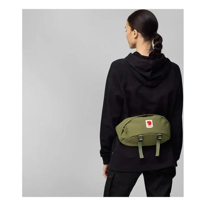 Back view of the Fjallraven Ulvo Hip Pack Large in Black on a model against a gray background.