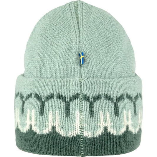 Back view of the Fjallraven Övik Path Knit Beanie in Chalk White Grey showing the pattern and a small flag detail.