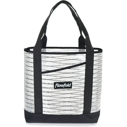 A front view of the Flowfold Recycled Sailcloth Porter Tote in Grey with black straps and a black bottom.