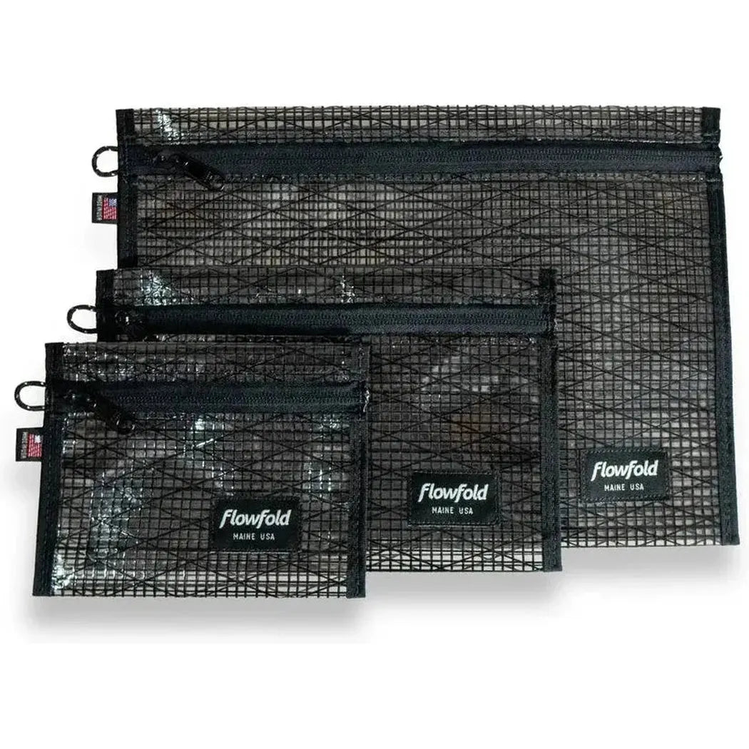 Three black Flowfold recycled sailcloth zipper pouches in varying sizes are displayed against a white background.