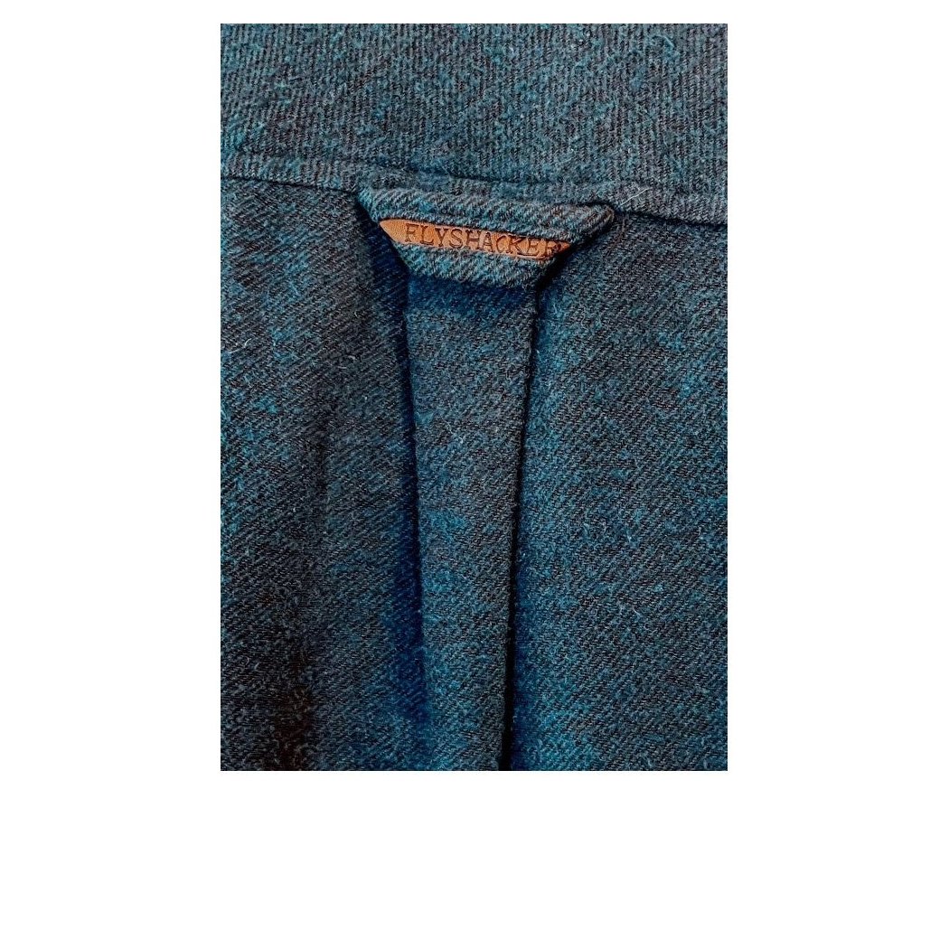 Close-up of the Flyshacker 2 Tone Solid Cavalry Twill Shirt showing the brand tag and KHA color fabric.