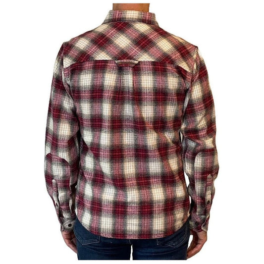 Back view of the Flyshacker Men's Granby Flannel Shirt - 8 oz showing the plaid pattern and long sleeves on a model wearing blue jeans.