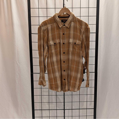 A front view of the Flyshacker Sample - Women's Snuggler Flannel Shirt in Ecru hanging on a wooden hanger against a grid background.