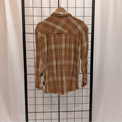 Back view of the Flyshacker Sample - Women's Snuggler Flannel Shirt in Ecru hanging on a hanger against a grid background.