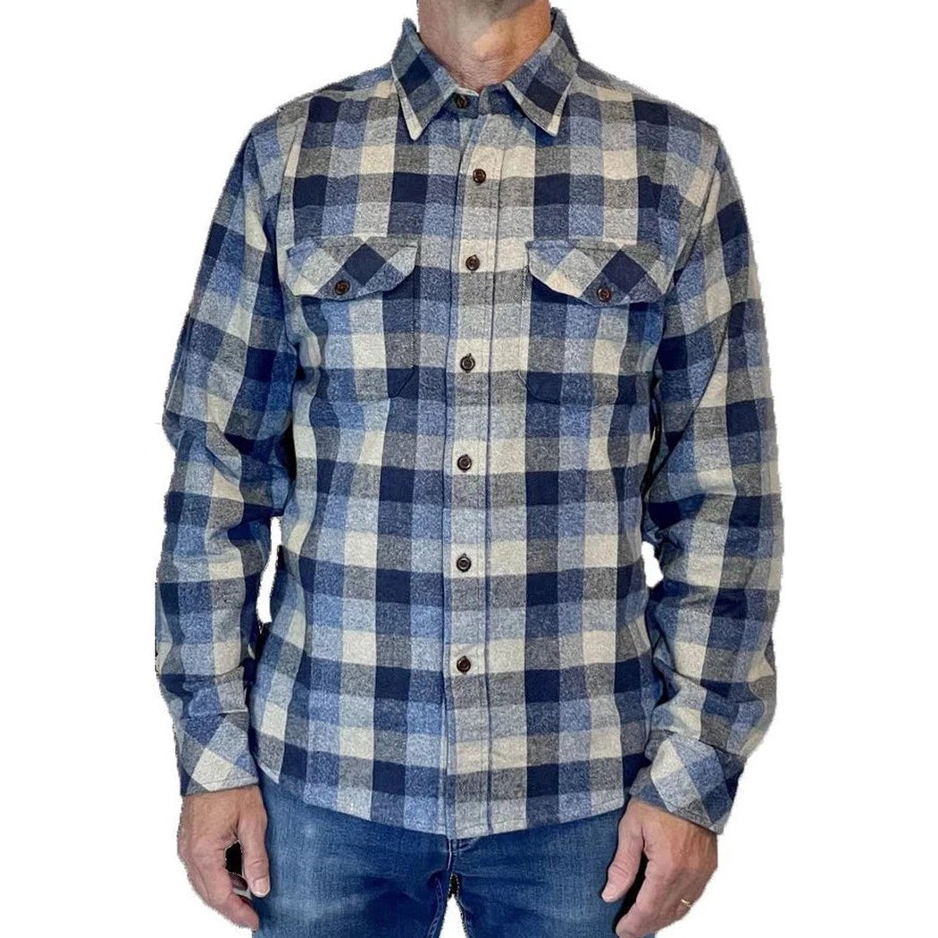 A front view of the Flyshacker South Fork Shirt in Blue on a model wearing blue jeans against a white background.