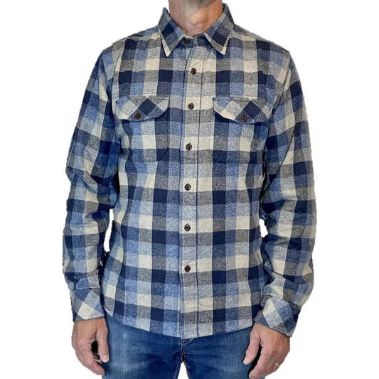 A front view of the Flyshacker South Fork Shirt in Blue on a model wearing blue jeans against a white background.