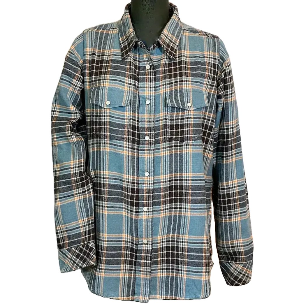 A front view of the Flyshacker Women's Passion Pearl Snap Flannel shirt in Dusty Teal on a black mannequin against a white background.