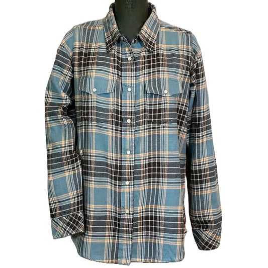 A front view of the Flyshacker Women's Passion Pearl Snap Flannel shirt in Dusty Teal on a black mannequin against a white background.