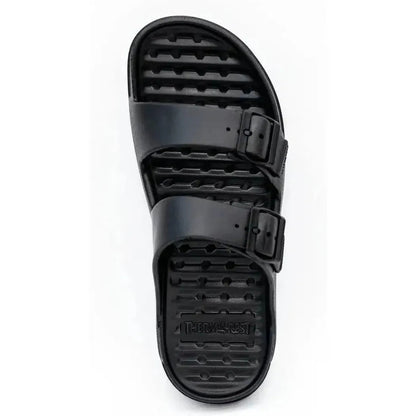 A top-down view of the Freewaters Women's Cloud9 Explorer in Black with two adjustable buckles and a textured sole against a white background.