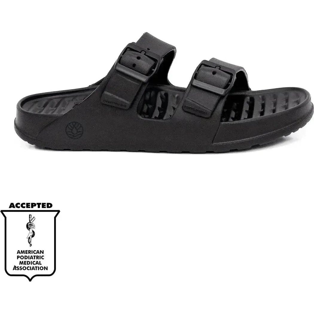Side view of the Freewaters Women's Cloud9 Explorer in Black showing the two buckle straps and textured sole against a white background.