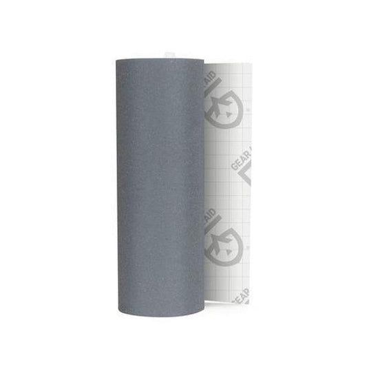 A roll of Gear Aid Tenacious Tape Reflective in Charcoal/Graphite, showing the reflective backing and grid pattern, against a white background.
