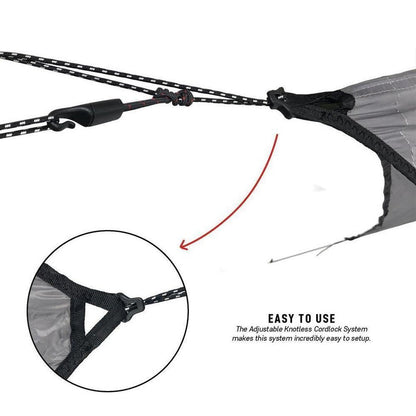 A close-up of the Grand Trunk Air Bivy All-Weather Shelter showing the adjustable knotless cordlock system and a zoomed-in detail of the attachment.