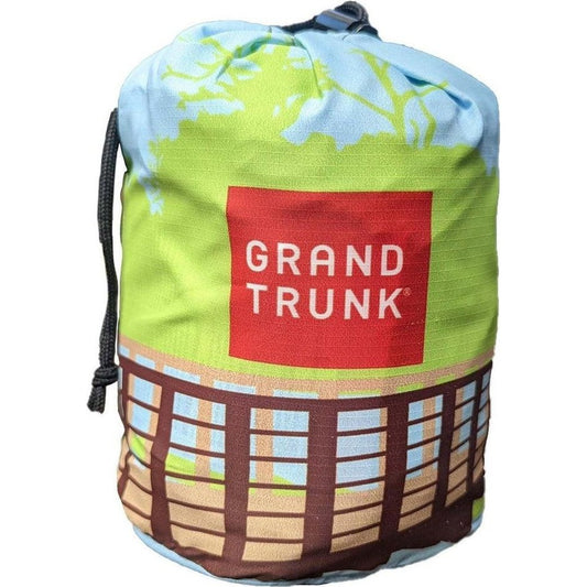 A Grand Trunk hammock bag with a colorful nature-themed design and drawstring closure.