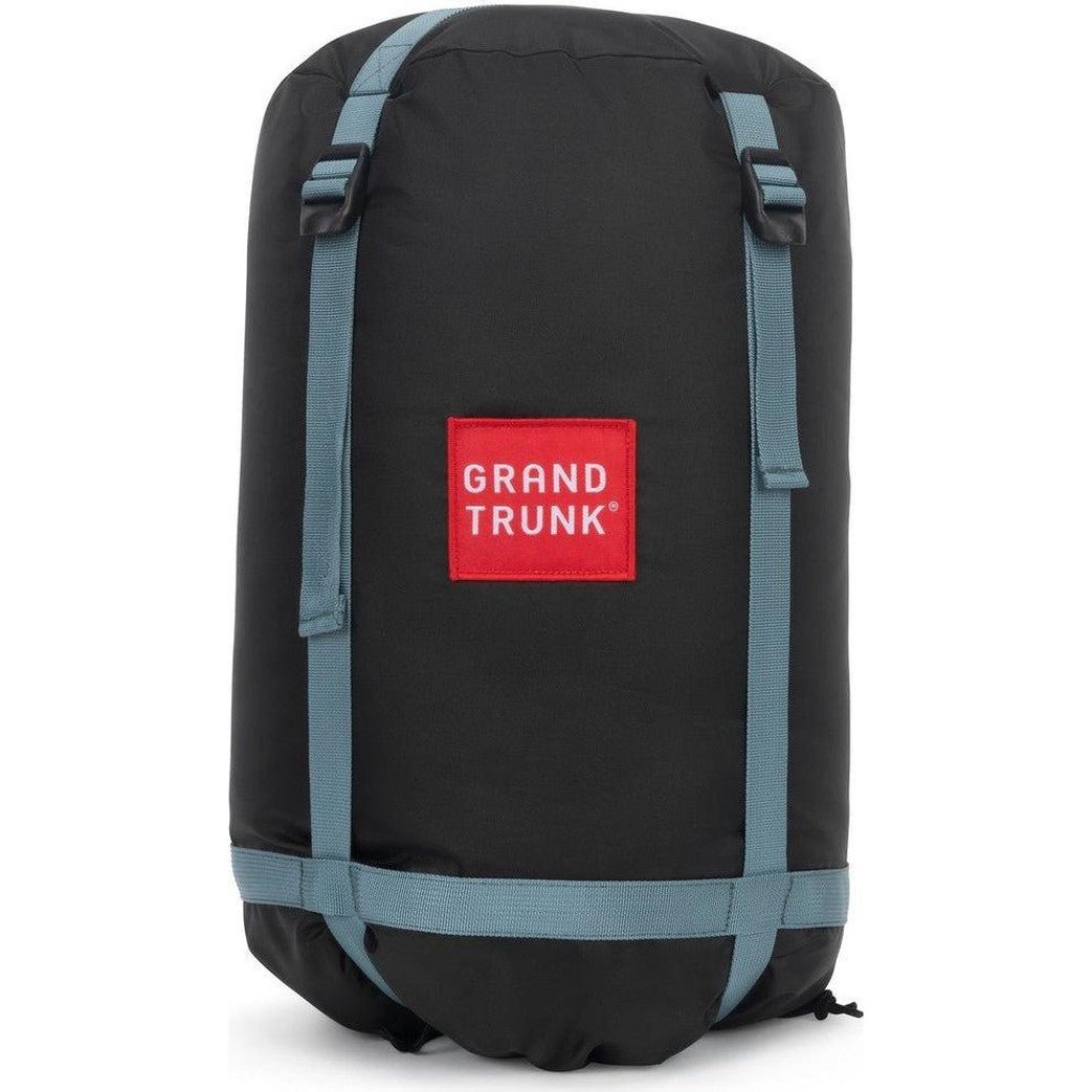 A front view of the Grand Trunk Evolution Down Hammock bag in black with blue straps and a red logo against a white background.