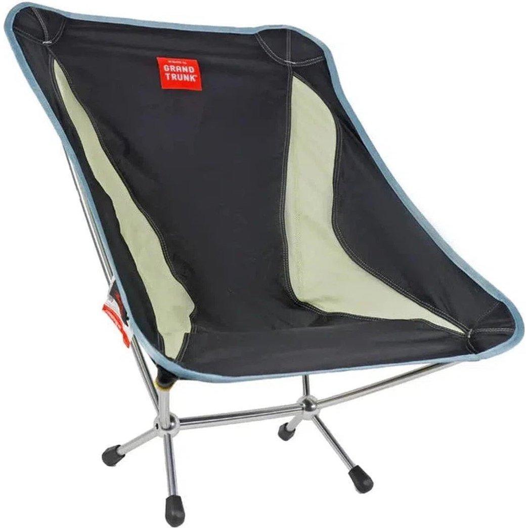 A side view of the Grand Trunk Mantis camping chair in Black with a light green accent panel and a silver metal frame.