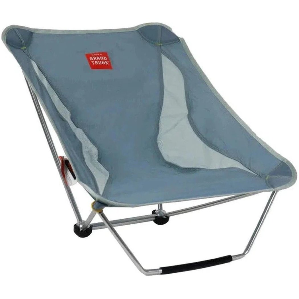 A side view of the Grand Trunk Mayfly camping chair in Black with a silver frame and black handle against a white background.