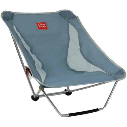 A side view of the Grand Trunk Mayfly camping chair in Black with a silver frame and black handle against a white background.