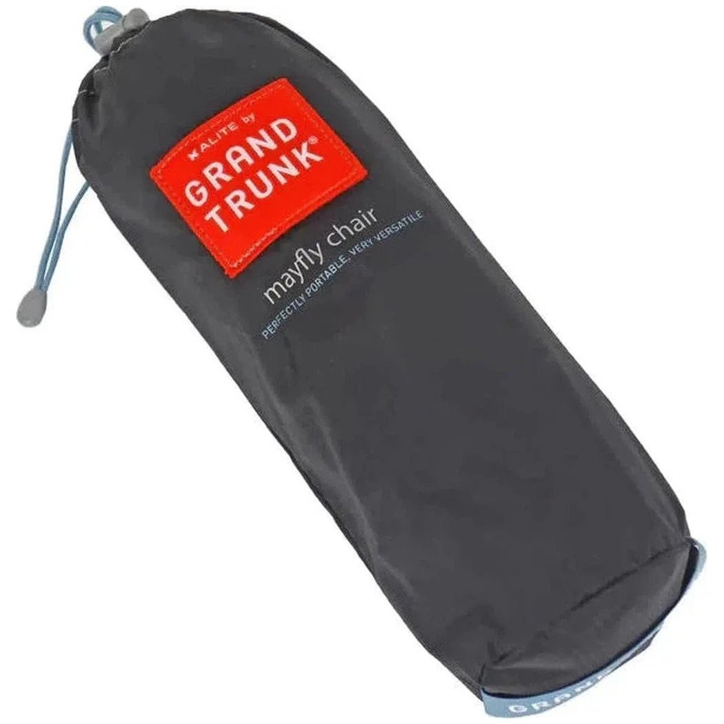 A black Grand Trunk Mayfly chair bag shown from a top-down angle with a red logo and drawstring visible.