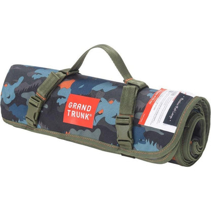 A rolled Grand Trunk Meadow Mat in Horizon camouflage with straps and a handle, shown from the side against a white background.