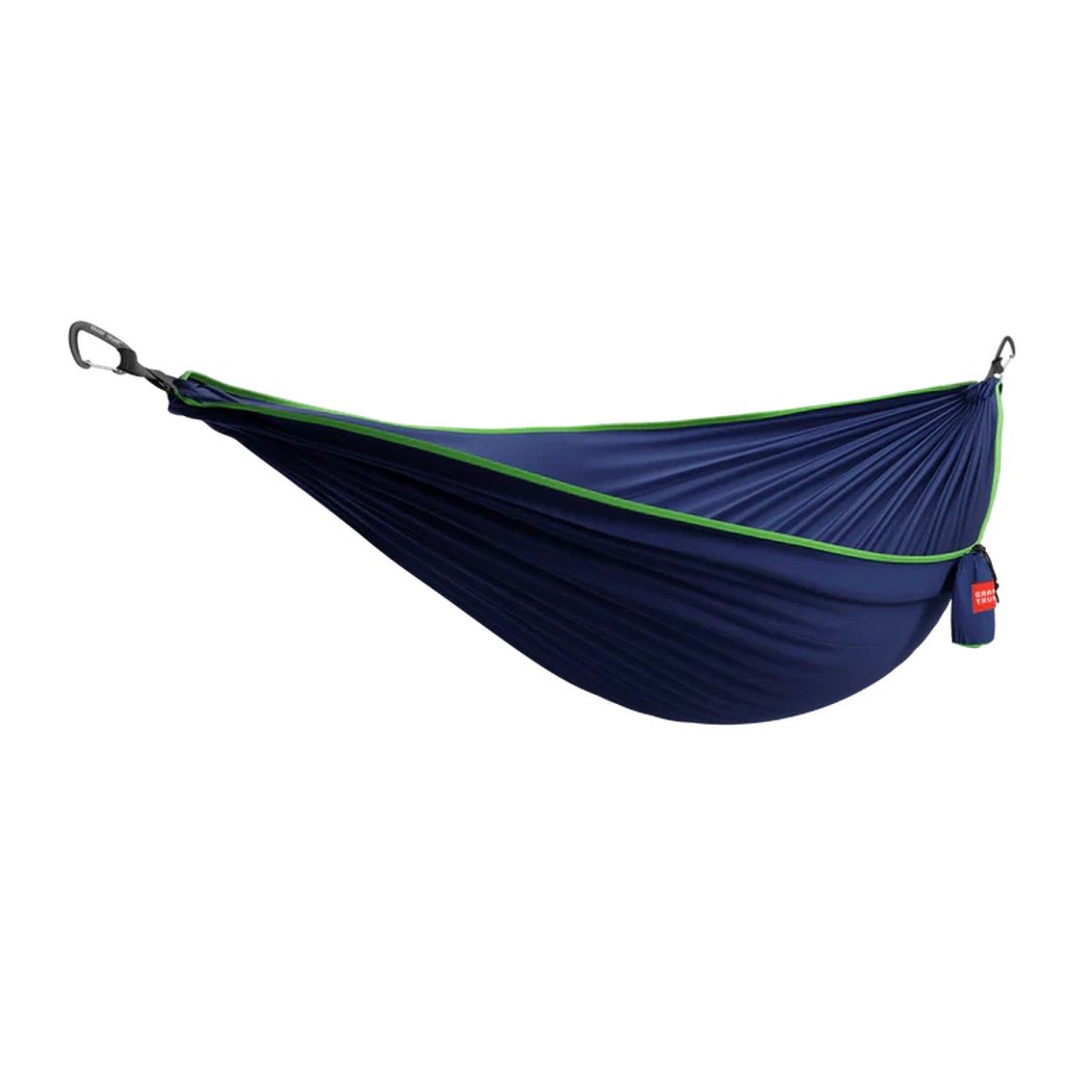 A navy and green Grand Trunk TRUNKTECH Double Hammock hangs from carabiners against a white background.