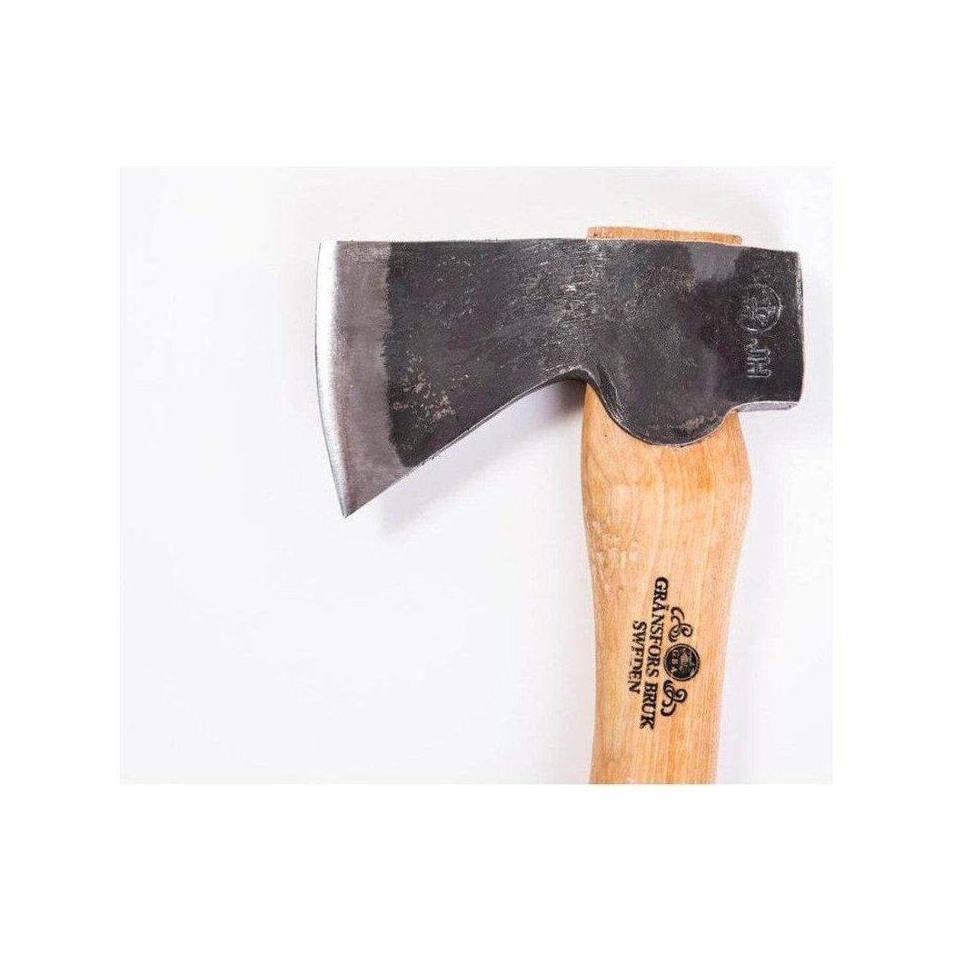 A top-down view of the Gransfors Bruk Hand Hatchet with its wooden handle and charcoal-colored blade against a white background.