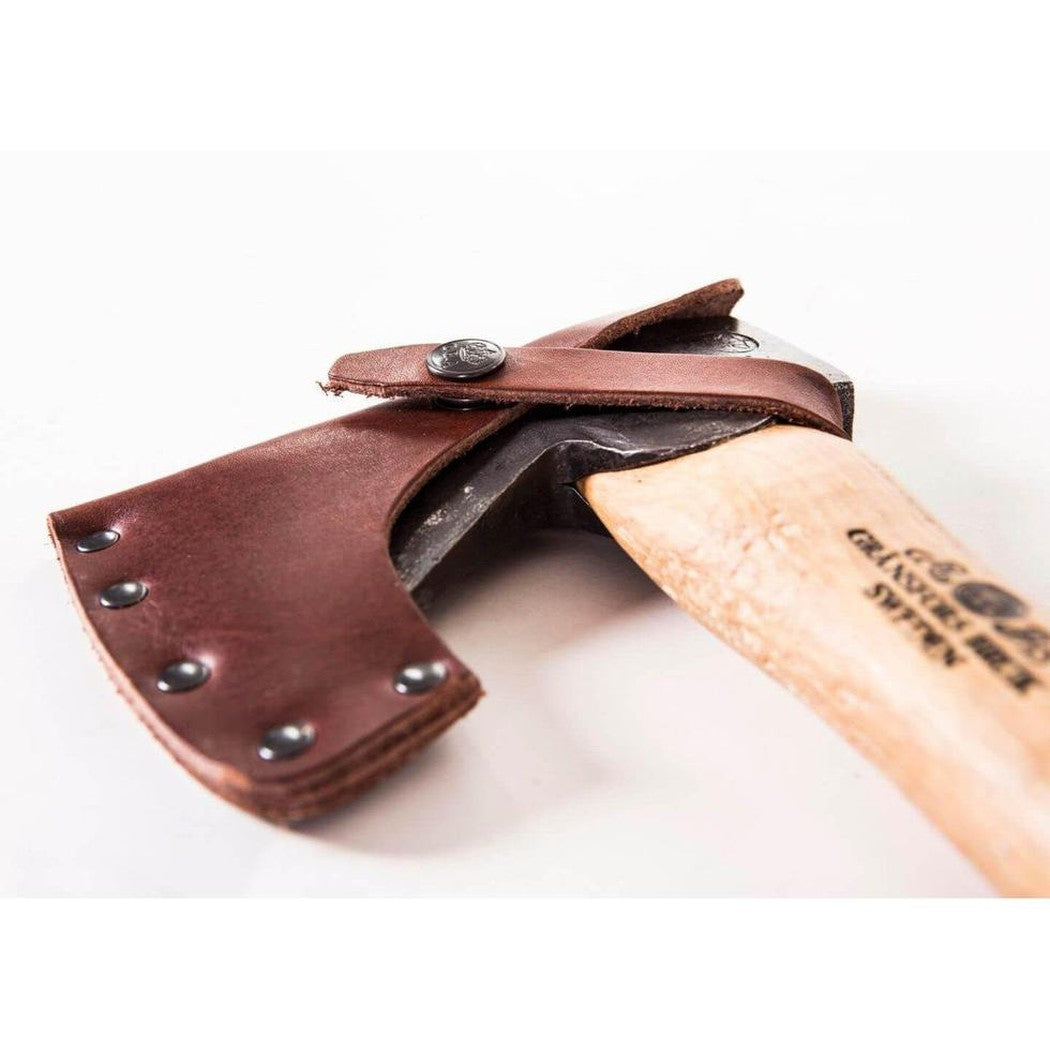 A close-up of the Gransfors Bruk Hand Hatchet with a brown leather sheath and wooden handle against a white background.