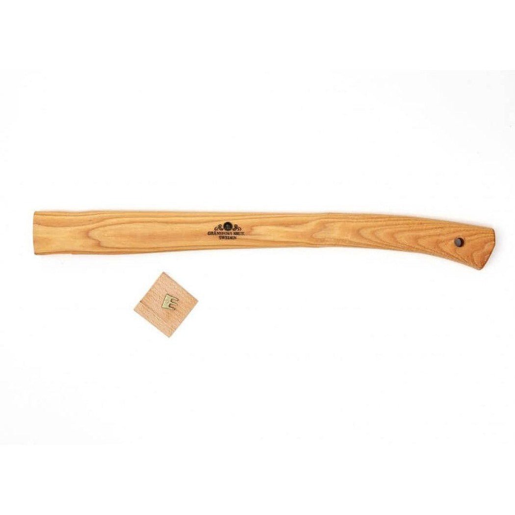 A natural wood Gransfors Bruk Handle for Hunter's Axe lies on a white background with a small wooden tag nearby.