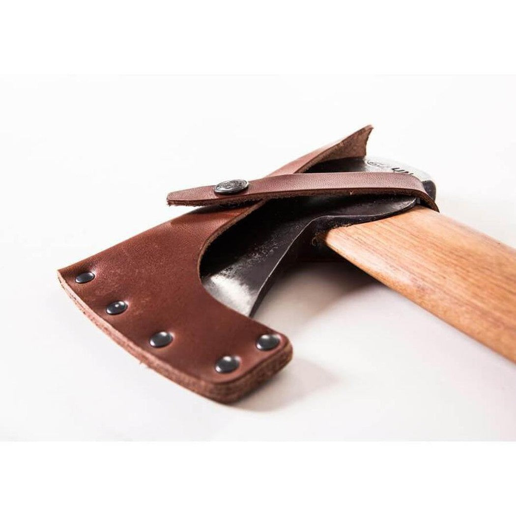 A close-up of the Gransfors Bruk Hunter's Axe with a brown leather sheath and wooden handle against a white background.
