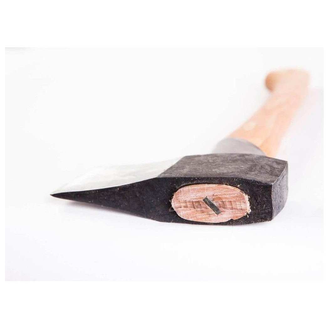 A close-up of the Gransfors Bruk Splitting Hatchet showing the wooden handle and the metal head with a nail embedded in the wooden insert, against a white background.