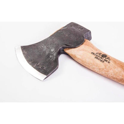 A side view of the Gransfors Bruk Swedish Carving Axe - Double Bevel with a wooden handle and a charcoal-colored double beveled blade against a white background.