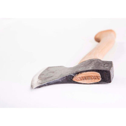 A left bevel Gransfors Bruk Swedish Carving Axe with a light wooden handle and charcoal/ graphite colored head sits on a white background.